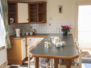 a kitchen with a counter top with mugs on it at Pendeen in Wadebridge