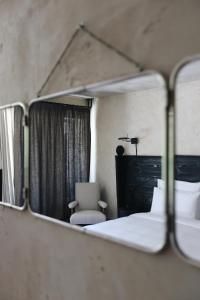 Voodi või voodid majutusasutuse Rooms Hotel Kokhta toas