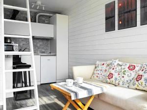 een woonkamer met een bank en een tafel bij 2 person holiday home in R nn ng in Rönnäng