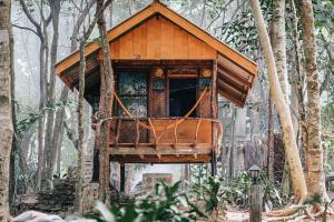 a tree house in the middle of the forest at Sunset Bungalow Koh Chang Ranong in Koh Chang Ranong