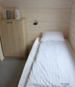 Tempat tidur dalam kamar di Na Klifie Wypoczynek&Spa