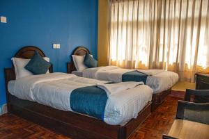 Katil atau katil-katil dalam bilik di Hotel Green Horizon