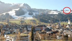 a view of a city with a red circle at Hof Zenzern in Kitzbühel