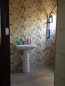 Een badkamer bij Guest House Kingdom