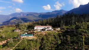 an aerial view of a house on a mountain at Lost & Found Hostels - Mandaramnuwara in Mandaran Newara