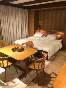 Una cama o camas en una habitación de APARTMENT CLUBHOTEL