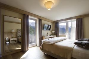 Ένα ή περισσότερα κρεβάτια σε δωμάτιο στο Hotel Lorenzetti