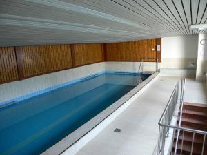 a large swimming pool in a building at Ferienwohnung Am Goldbach Pool Sauna in Obermaiselstein