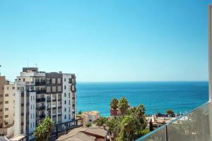 a view of the ocean from the balcony of a building at Calpe Beach in Calpe