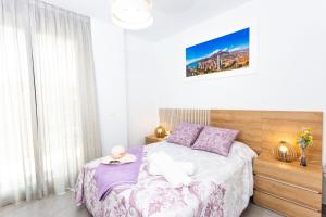 a bedroom with a bed with a plate on it at Calpe Beach in Calpe