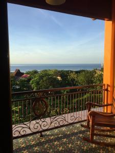 a balcony with a view of the ocean at Villa Ma'Rasai in Ternate
