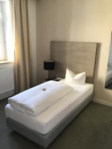 Postel nebo postele na pokoji v ubytování Garni Hotel Schmaus