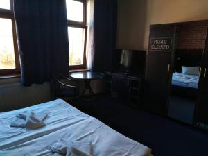 Ένα ή περισσότερα κρεβάτια σε δωμάτιο στο Hotel Chicago