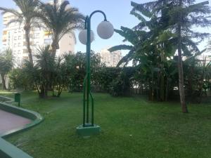 Vonkajšia záhrada v ubytovaní CANCÚN III Solo Familias Serviplaya