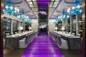 a banquet hall with long tables and blue chandeliers at Crowne Plaza Hong Kong Causeway Bay, an IHG Hotel in Hong Kong