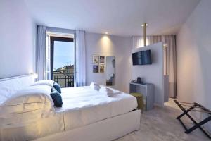 Posteľ alebo postele v izbe v ubytovaní Boutique Hotel de la Ville