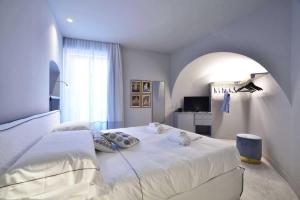 Posteľ alebo postele v izbe v ubytovaní Boutique Hotel de la Ville