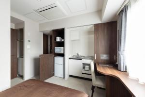 Virtuve vai virtuves zona naktsmītnē Hotel Classe Stay Sapporo