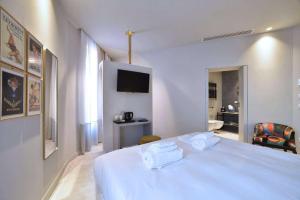 Posteľ alebo postele v izbe v ubytovaní Boutique Hotel de la Ville