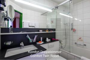 Ванна кімната в Hotel Hirschen - Grindelwald