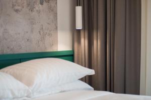 Postel nebo postele na pokoji v ubytování Smart Hotel Napoli