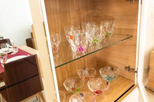 a glass cabinet with many empty wine glasses on it at Calpe Beach in Calpe
