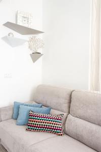 a couch with pillows on it in a living room at Calpe Beach in Calpe