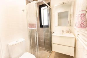 a bathroom with a shower and a toilet and a sink at Calpe Beach in Calpe