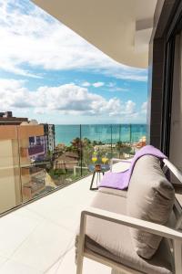 a room with a balcony with a view of the ocean at Calpe Beach in Calpe
