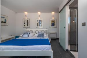 Un pat sau paturi într-o cameră la Casa Vita Apartments