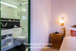 Ванна кімната в Hotel Hirschen - Grindelwald