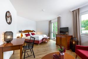 Postel nebo postele na pokoji v ubytování Hotel Prinzregent München Messe