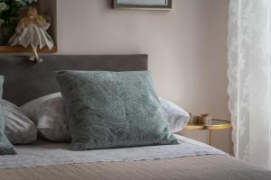 Posteľ alebo postele v izbe v ubytovaní Apartments & Rooms Perla