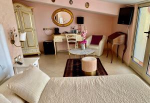 a living room with a couch and a table at Hotel Scilla in Scilla