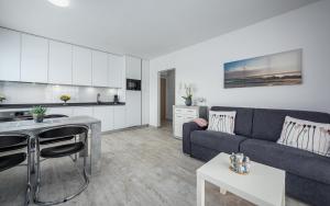 a living room with a couch and a kitchen at SOFIA house with apartment in Umag