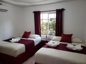 Katil atau katil-katil dalam bilik di Hotel Playa Caribe