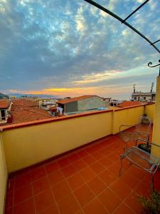 a balcony with a view of a city at Hotel Scilla in Scilla