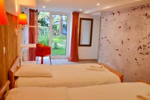 Ένα ή περισσότερα κρεβάτια σε δωμάτιο στο Embassy Corner