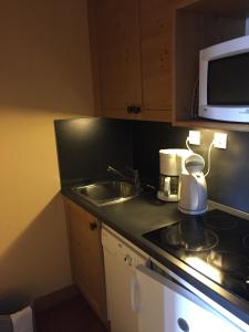 Ett kök eller pentry på Appartement cozy centre Alpe d'Huez