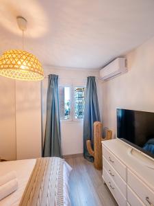 Telewizja i/lub zestaw kina domowego w obiekcie PREMIUM BEACH DESIGN - La Malagueta