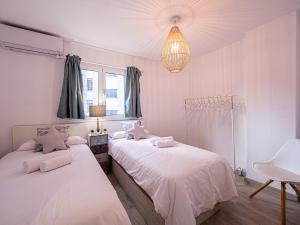 Łóżko lub łóżka w pokoju w obiekcie PREMIUM BEACH DESIGN - La Malagueta