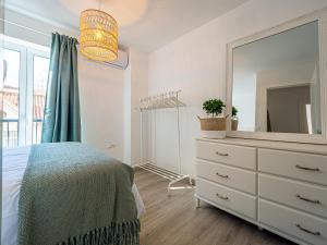 Łóżko lub łóżka w pokoju w obiekcie PREMIUM BEACH DESIGN - La Malagueta