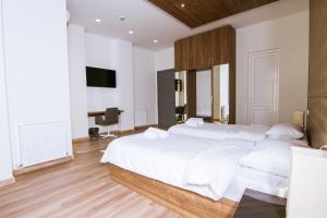 Postel nebo postele na pokoji v ubytování Victoria Inn Tbilisi