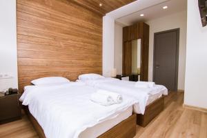 Postel nebo postele na pokoji v ubytování Victoria Inn Tbilisi