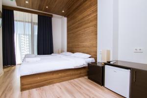 Postel nebo postele na pokoji v ubytování Victoria Inn Tbilisi