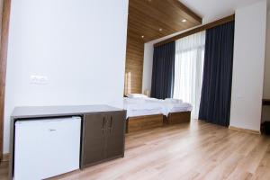 Postel nebo postele na pokoji v ubytování Victoria Inn Tbilisi