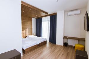Postel nebo postele na pokoji v ubytování Victoria Inn Tbilisi