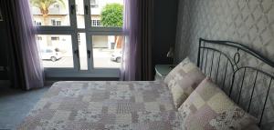 Posteľ alebo postele v izbe v ubytovaní CanariasBrisaMar - Apartamento