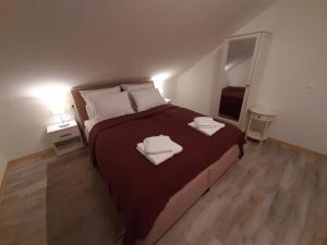 Postel nebo postele na pokoji v ubytování Apartment Queen