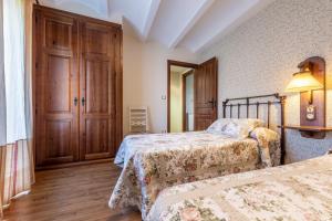 Una cama o camas en una habitación de Casa Bergua